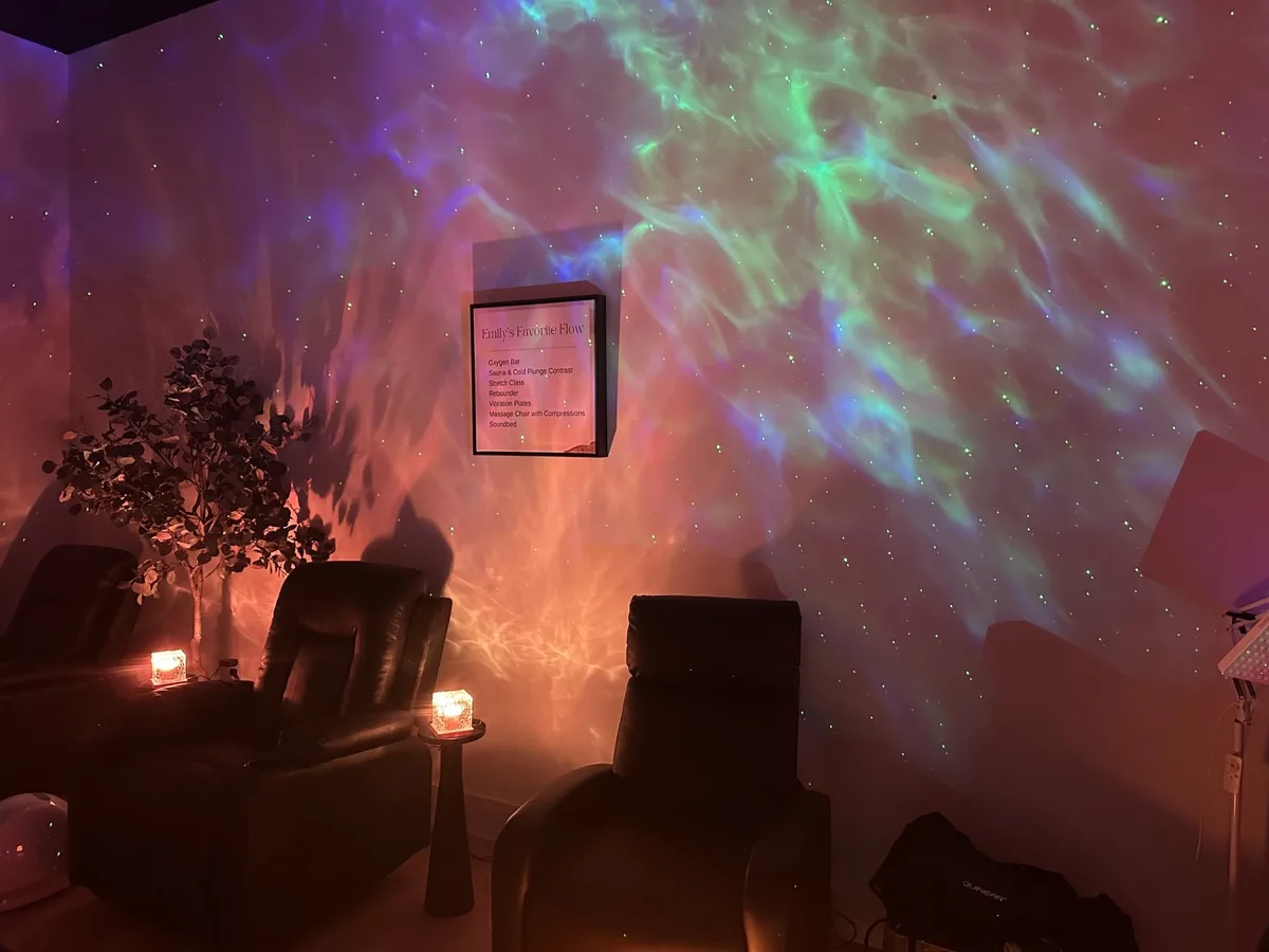 The recovery lounge at Health House Rolesville, reclining chairs under a nebula projection